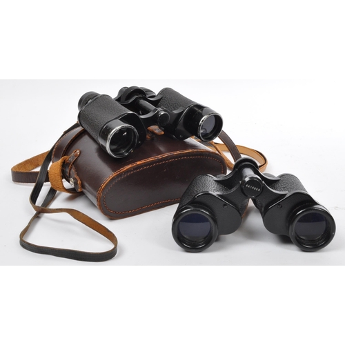 176 - Two 20th Century vintage binoculars, one made by Carl Zeiss, the other Invincible in leather case.
