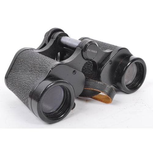 176 - Two 20th Century vintage binoculars, one made by Carl Zeiss, the other Invincible in leather case.