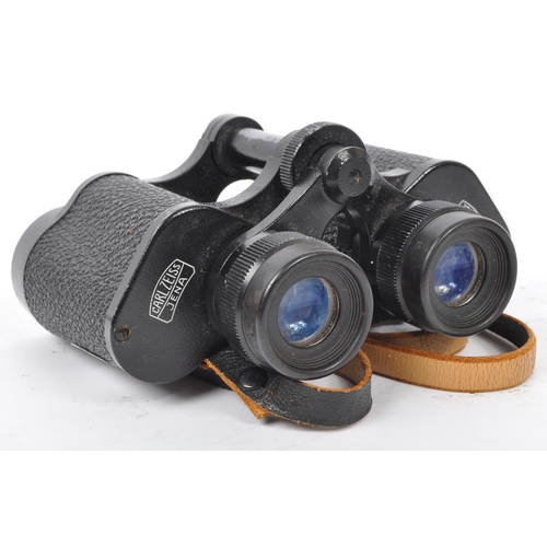 176 - Two 20th Century vintage binoculars, one made by Carl Zeiss, the other Invincible in leather case.