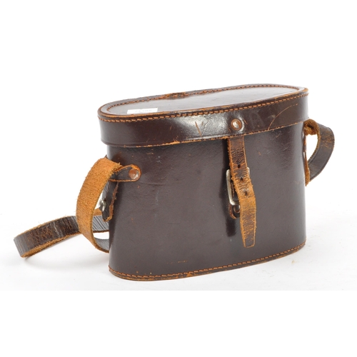 176 - Two 20th Century vintage binoculars, one made by Carl Zeiss, the other Invincible in leather case.