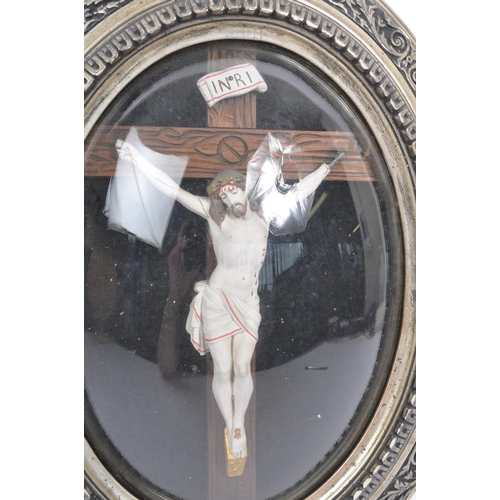 178 - An early 20th Century Catholic stucco crucifix depicting Christ on a wooden cross  against a black b... 