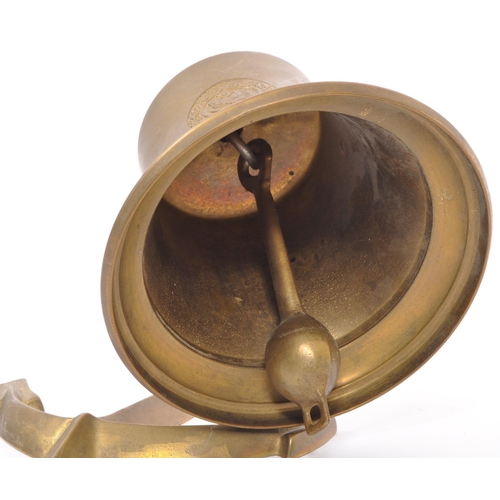 349 - A 20th Century vintage brass ship bell marked 'MS Bremen 1911' with anchor attachment. Measuring app... 
