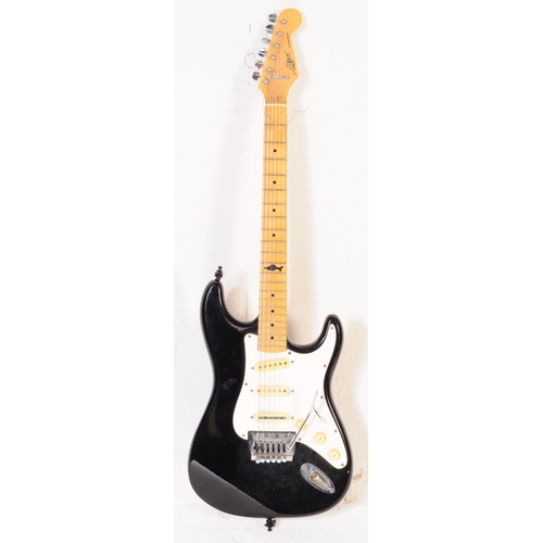415 - Marlin sidewinder electric guitar. Having an ebonised shaped body with white fret board and beech ne... 