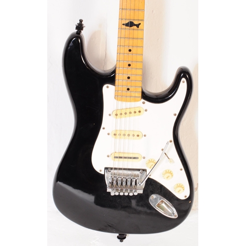 415 - Marlin sidewinder electric guitar. Having an ebonised shaped body with white fret board and beech ne... 