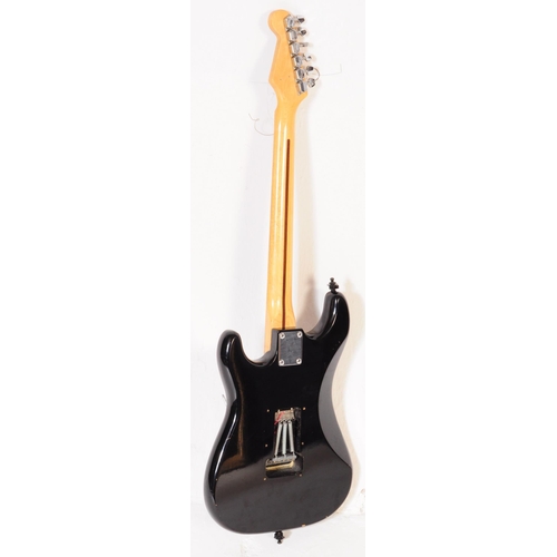 415 - Marlin sidewinder electric guitar. Having an ebonised shaped body with white fret board and beech ne... 