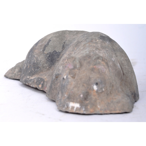 196 - A Tang Dynasty Chinese hand moulded clay earthenware burial funerary figure of a lying dog with pain... 