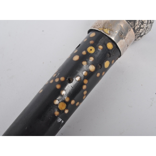 199 - A High Victorian walking stick / cane with silver top, floral repousse decorated, on mahogany stick ... 