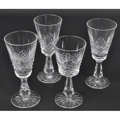 154 - A collection of 19th century and later glass decanters and drinking glasses to include signed Tudor ... 