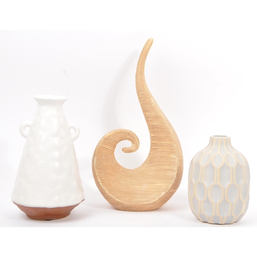 171 - A collection of contemporary studio art pottery. Comprising of a tapering twin handled vase, a textu... 