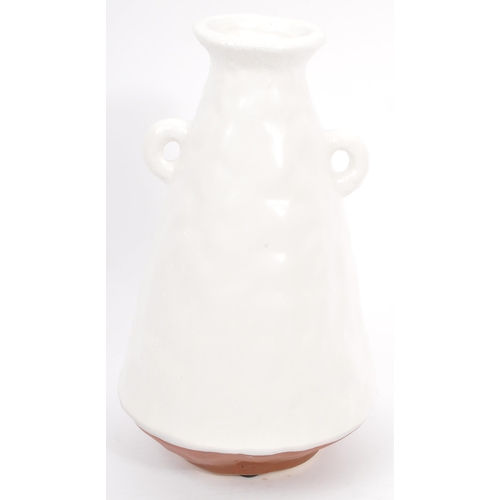 171 - A collection of contemporary studio art pottery. Comprising of a tapering twin handled vase, a textu... 