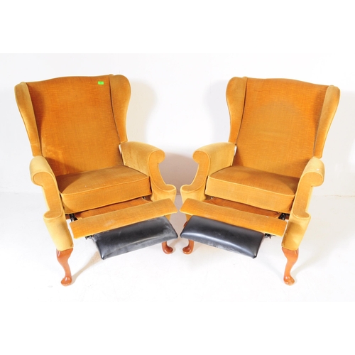566 - Parker Knoll - A pair of vintage retro mid 20th century Parker Knoll wing back armchairs upholstered... 