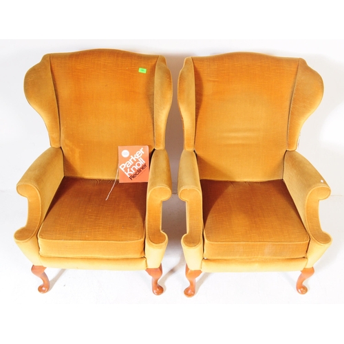 566 - Parker Knoll - A pair of vintage retro mid 20th century Parker Knoll wing back armchairs upholstered... 