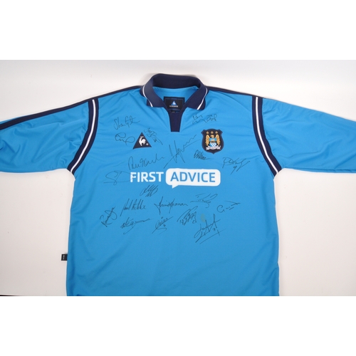 399 - A large collection of vintage 20th century and later Manchester City Football club shirts, T shirts ... 