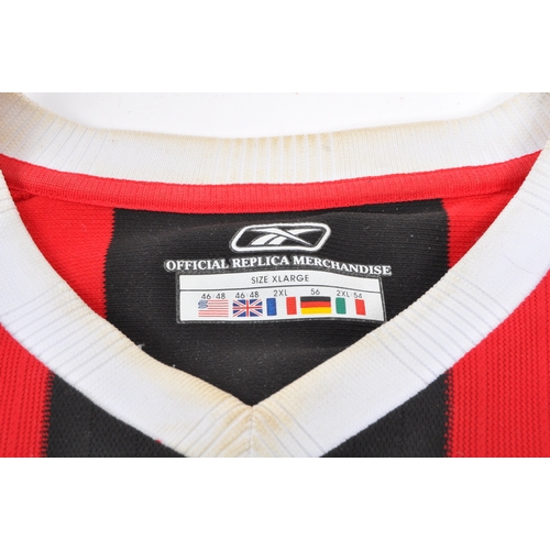 399 - A large collection of vintage 20th century and later Manchester City Football club shirts, T shirts ... 