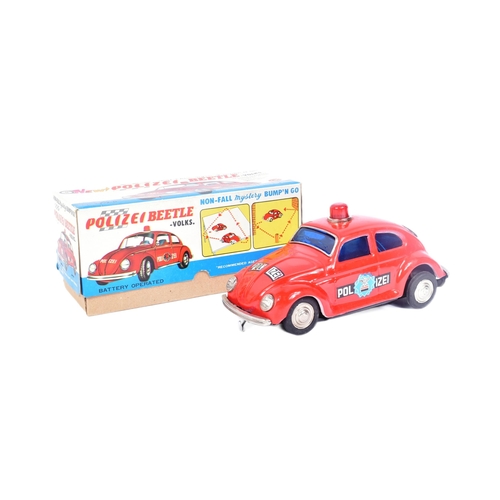 101 - Tinplate Toys - a vintage Taiwanese made tinplate battery operated Volkswagen Police Car. Bump n Go ... 