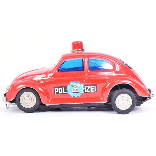 101 - Tinplate Toys - a vintage Taiwanese made tinplate battery operated Volkswagen Police Car. Bump n Go ... 