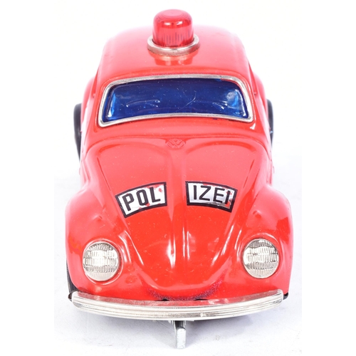 101 - Tinplate Toys - a vintage Taiwanese made tinplate battery operated Volkswagen Police Car. Bump n Go ... 