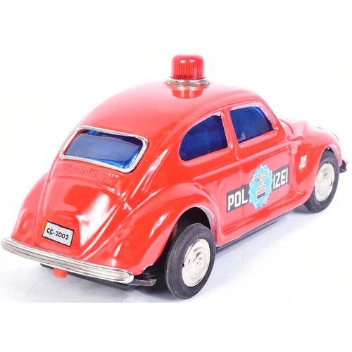 101 - Tinplate Toys - a vintage Taiwanese made tinplate battery operated Volkswagen Police Car. Bump n Go ... 