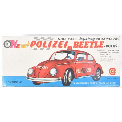 101 - Tinplate Toys - a vintage Taiwanese made tinplate battery operated Volkswagen Police Car. Bump n Go ... 