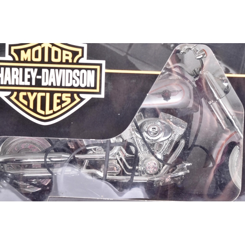 104 - An official Harley Davidson licensed ' Fat Boy ' novelty telephone. Two piece model operated by lift... 