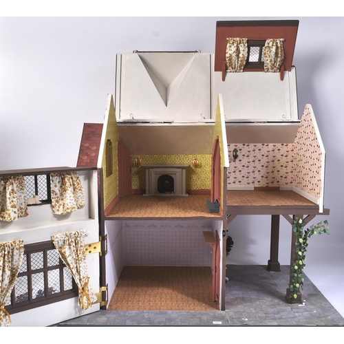 130 - Dolls House - a hand built scratch built wooden dolls house in the style of a traditional tudor mano... 