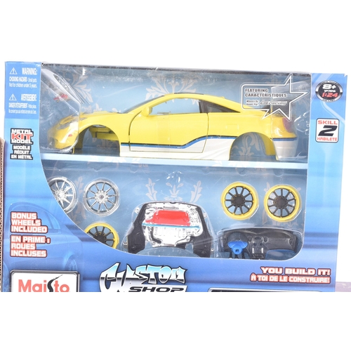 131 - Diecast - a collection of x4 assorted 1/18 scale diecast model cars comprising; Burago Lamborghini M... 