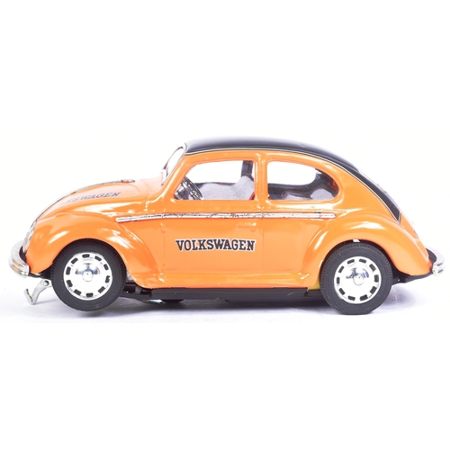 148 - Tinplate Toys - a vintage Japanese (Taiyo) tinplate battery operated Volkswagen Beetle. Bump n Go ac... 