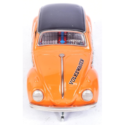 148 - Tinplate Toys - a vintage Japanese (Taiyo) tinplate battery operated Volkswagen Beetle. Bump n Go ac... 