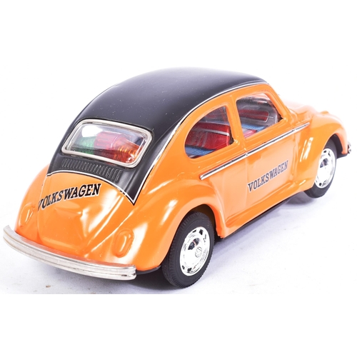 148 - Tinplate Toys - a vintage Japanese (Taiyo) tinplate battery operated Volkswagen Beetle. Bump n Go ac... 