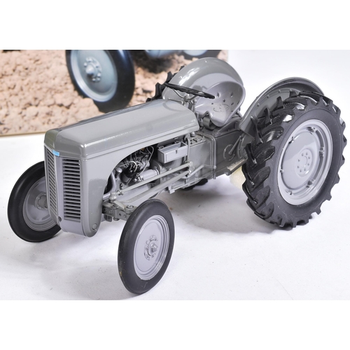 Six Universal Hobbies 1:16 scale model tractors, comprising