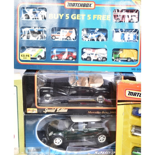 209 - Diecast - a collection of assorted boxed diecast model cars and other vehicles of various scales and... 