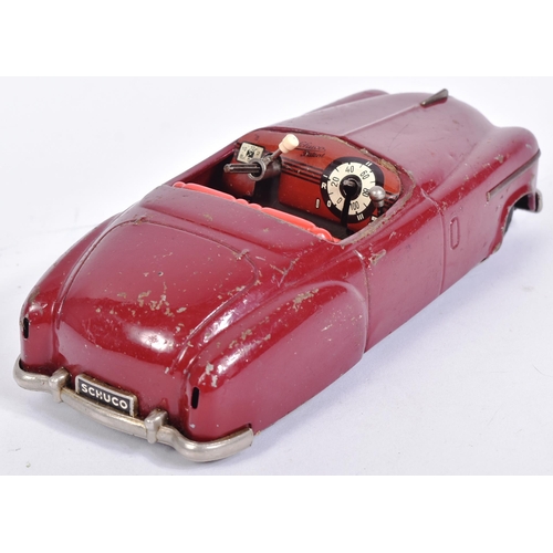 217 - An original vintage West German Schuco made tinplate clockwork model car ' Combinato 4003 '. The clo... 