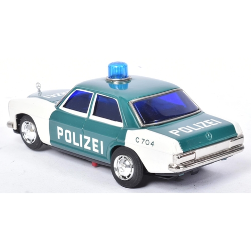 231 - Tinplate Toys - x2 vintage Japanese (Taiyo) tinplate battery operated police cars. One being a Highw... 