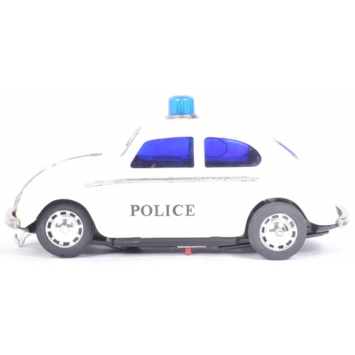 249 - Tinplate Toys - a vintage Japanese (Taiyo) tinplate battery operated VW Volkswagen Police Car with B... 