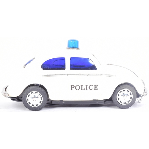 249 - Tinplate Toys - a vintage Japanese (Taiyo) tinplate battery operated VW Volkswagen Police Car with B... 