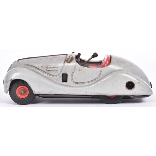 26 - An original vintage West German Schuco made tinplate clockwork model car ' Examico 4001 '. Grey with... 