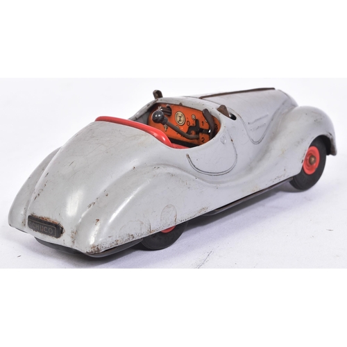 26 - An original vintage West German Schuco made tinplate clockwork model car ' Examico 4001 '. Grey with... 