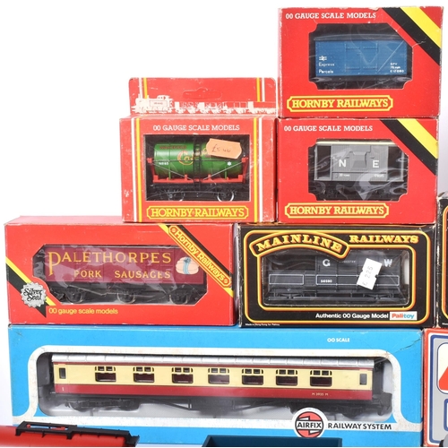 281 - An assortment of vintage model railway trainset wagons, coaches and carriages from various makers su... 