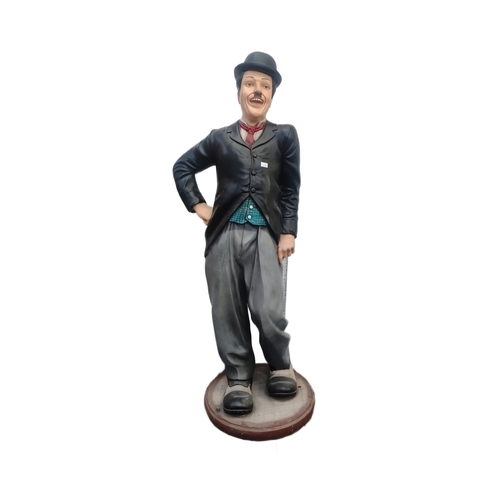 300 - Charlie Chaplin - a large lifesize 1/1 scale statue of Chaplin, depicted in his trademark suit with ... 