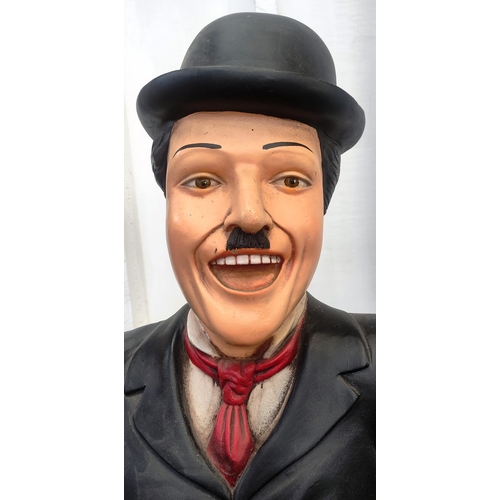 300 - Charlie Chaplin - a large lifesize 1/1 scale statue of Chaplin, depicted in his trademark suit with ... 