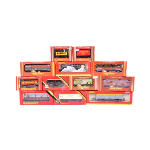 49 - A collection of assorted OO gauge model railway trainset locomotive rolling stock wagons, vans and c... 