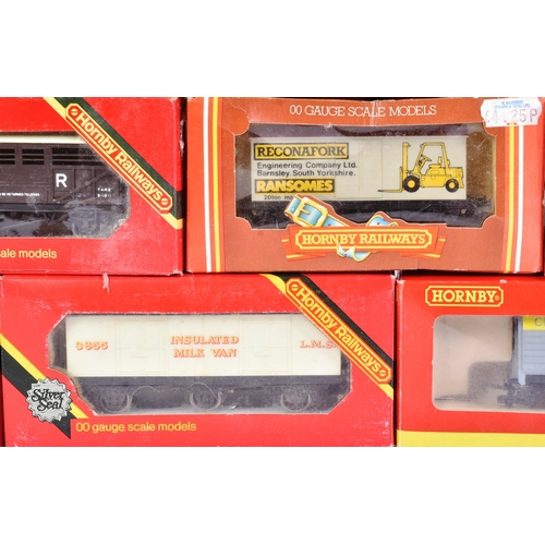 49 - A collection of assorted OO gauge model railway trainset locomotive rolling stock wagons, vans and c... 