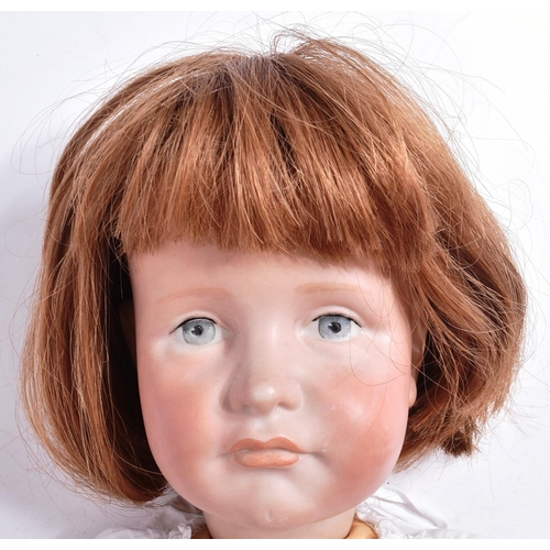 50 - An early 20th Century German ' Kammer & Reinhardt ' bisque headed doll with a replacement compositio... 