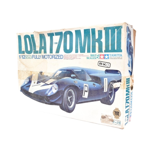 99 - Model Kit - a vintage Tamiya 1/12 scale motorized Lola T-70 MKIII model kit. The kit partially assem... 