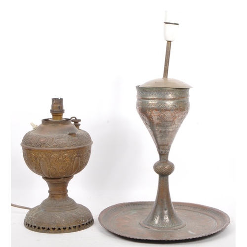 809 - Two 19th century hammered copper and brass Indian converted desk lamps. One having a embossed floral... 