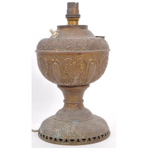 809 - Two 19th century hammered copper and brass Indian converted desk lamps. One having a embossed floral... 