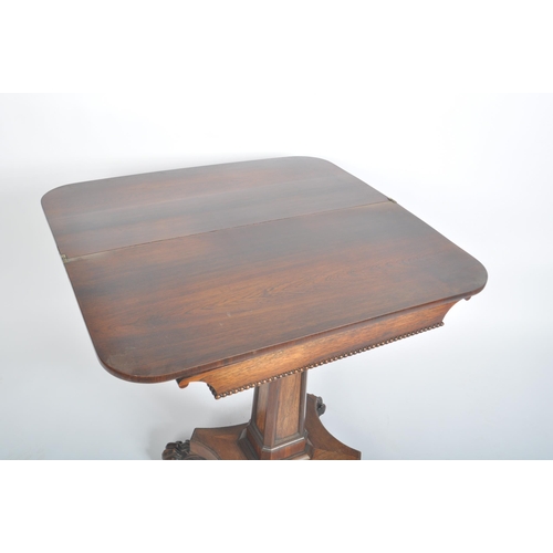 108 - A 19th century William IV rosewood games / card fold over table. The table having a rounded rectangu... 