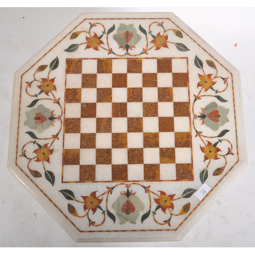 110 - A 20th century Indian inlaid pietra dura marble occasional chess games  table. The table having the ... 