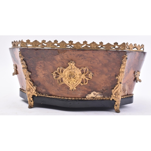 128 - A 19th century Victorian walnut and ormolu planter. The planter of serpentine form with ormolu worke... 