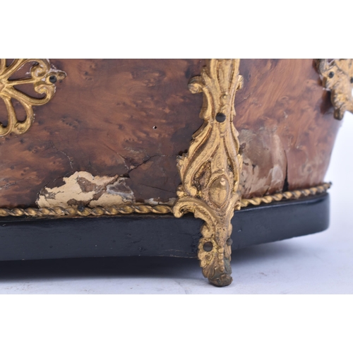 128 - A 19th century Victorian walnut and ormolu planter. The planter of serpentine form with ormolu worke... 